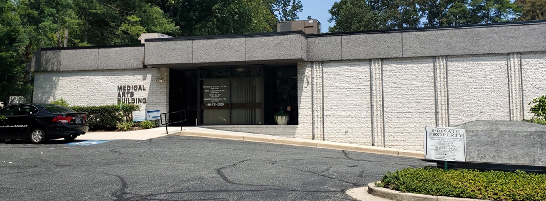 The image shows a building with a sign that reads MASSACHUSETTS STATE POLICE outside, indicating it s a law enforcement facility.